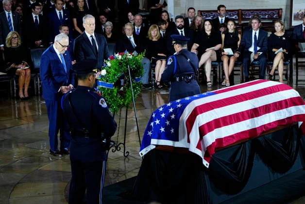 Senate Majority Leader John Thune and Senate Minority Leader Chuck Schumer pay their respects during a Congressional Tribute to honor the late Sen. Lindsey Graham, R-SC, in the Rotunda of the U.S. Capitol in Washington, DC on Tuesday, July 28, 2026. Graham, who served in Congress for 31 years, died on July 11 at the age of 71.  WAP20260728931 BONNIExCASH
