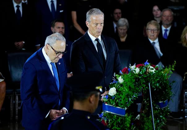 Senate Majority Leader John Thune (R) and Senate Minority Leader Chuck Schumer pay their respects during a Congressional Tribute to honor the late Sen. Lindsey Graham, R-SC, in the Rotunda of the U.S. Capitol in Washington, DC on Tuesday, July 28, 2026. Graham, who served in Congress for 31 years, died on July 11 at the age of 71.  WAP20260728932 BONNIExCASH