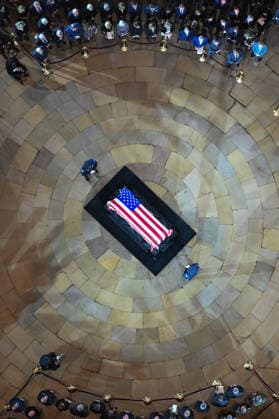 The casket of the late Sen. Lindsey Graham lies in the Rotunda of the U.S. Capitol during a Congressional tribute in Washington DC on Tuesday, July 28, 2026. Graham, who served South Carolina in Congress for 31 years, died on July 11 at the age of 71. Pool  WASP20260728105 KENNYxHOLSTON