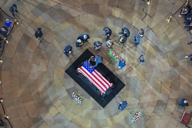 The casket of the late Sen. Lindsey Graham lies in the Rotunda of the U.S. Capitol during a Congressional tribute in Washington DC on Tuesday, July 28, 2026. Graham, who served South Carolina in Congress for 31 years, died on July 11 at the age of 71. Pool  WASP20260728109 KENNYxHOLSTON