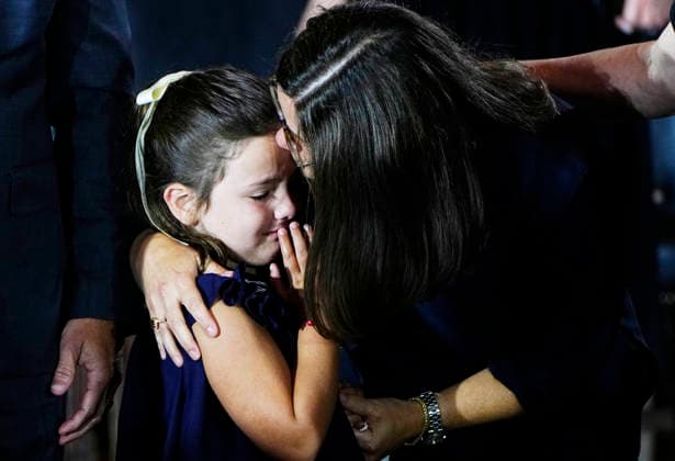A young family member is comforted during a Congressional Tribute to honor the late Sen. Lindsey Graham in the Rotunda of the U.S. Capitol in Washington DC on Tuesday, July 28, 2026. Graham, who served South Carolina in Congress for 31 years, died on July 11 at the age of 71.  WAP20260728948 BONNIExCASH