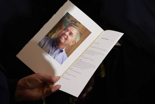 Lindsey Graham Memorial Service in the US Capitol An attendee holds a program during a ceremony for late Republican Senator Lindsey Graham in the rotunda of the US Capitol in Washington, DC, US, on Tuesday, July 28, 2026. Lindsey Graham, the South Carolina senior senator and foreign policy hawk who changed from a Donald Trump skeptic to one of the US president s strongest allies, died on July 11 at the age of 71. Credit: Tierney L. Cross Pool via CNP Washington District of Columbia United States of America EDITORIAL USE ONLY Copyright: xx FTP_4T8A3661-6471760 TierneyxL.xCrossx-xPoolxviaxCNPx cnpphotos338118