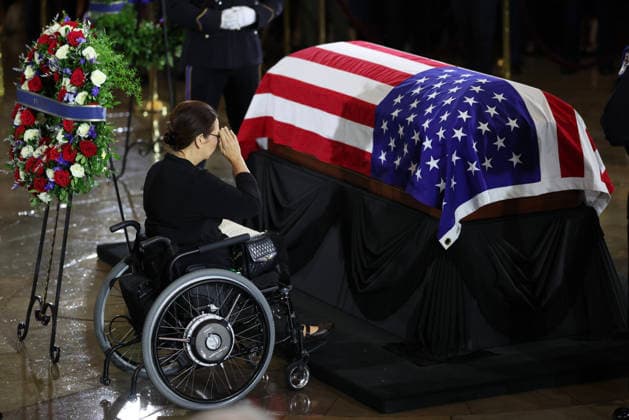Lindsey Graham Memorial Service in the US Capitol WASHINGTON, DC - JULY 28: U.S. Sen. Tammy Duckworth (D-IL) pays her respects over the casket as it lies in state during a memorial tribute for the late U.S. Sen. Lindsey Graham (R-SC) in the Rotunda of the U.S. Capitol on July 28, 2026 in Washington, DC. Graham, who was elected to the Senate in 2002, died suddenly on July 11th from an aortic dissection. He was 71 years old. Credit: Win McNamee Pool via CNP Washington District of Columbia United States of America EDITORIAL USE ONLY Copyright: xx GYI2288015972-6472084 WinxMcNameex-xPoolxviaxCNPx cnpphotos338266