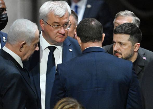 President Volodymyr Zelensky of Ukraine (R) speaks with Prime Minister Benjamin Netanyahu of Israel as they attend the funeral service for the late Sen. Lindsey Graham, R-SC, at Washington National Cathedral in Washington, DC on Tuesday, July 28, 2026. Zelensky and Netanyahu met with President Donald Trump earlier in the day.  WAP20260728804 ANNABELLExGORDON