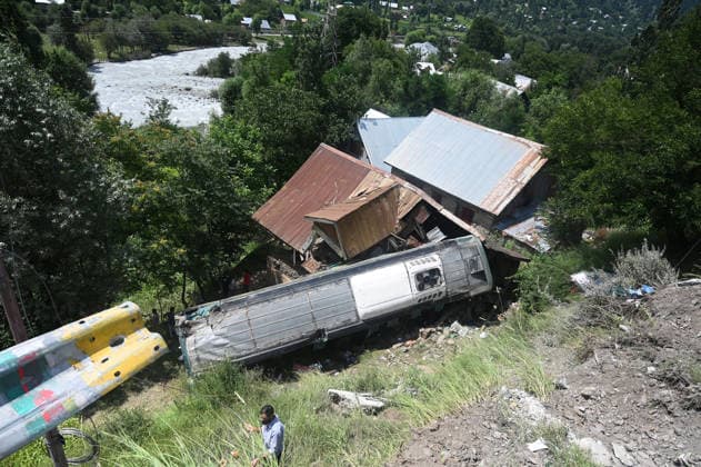 GANDERBAL, INDIA - JULY 28: A heavily damaged bus carrying Amarnath Yatra pilgrims rests along a steep embankment after skidding off the road and plunging into a deep gorge at the S-Mode stretch near Hariganiwan in the Gund area on July 28, 2026 in Ganderbal, India. The bus carrying around 40 pilgrims returning from the Baltal base camp toward Srinagar after performing darshan at the holy cave shrine, lost control while negotiating a treacherous curve. At least 39 pilgrims hailing from Madhya Pradesh, Rajasthan, and Delhi sustained injuries in the crash, which brought a swift multi-agency rescue operations. (Photo by Waseem Andrabi Hindustan Times) 39 Injured After Bus Carrying Amarnath Pilgrims Skids In Ganderbal