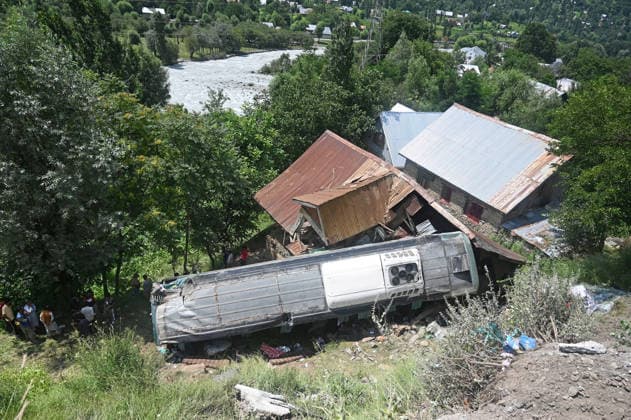 GANDERBAL, INDIA - JULY 28: A heavily damaged bus carrying Amarnath Yatra pilgrims rests along a steep embankment after skidding off the road and plunging into a deep gorge at the S-Mode stretch near Hariganiwan in the Gund area on July 28, 2026 in Ganderbal, India. The bus carrying around 40 pilgrims returning from the Baltal base camp toward Srinagar after performing darshan at the holy cave shrine, lost control while negotiating a treacherous curve. At least 39 pilgrims hailing from Madhya Pradesh, Rajasthan, and Delhi sustained injuries in the crash, which brought a swift multi-agency rescue operations. (Photo by Waseem Andrabi Hindustan Times) 39 Injured After Bus Carrying Amarnath Pilgrims Skids In Ganderbal