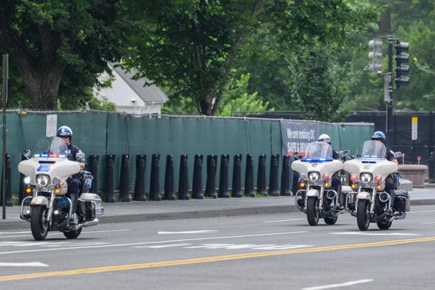 July 28, 2026, Washington, District Of Columbia, United States: Motorcycle officers clear the route as President Donald TRUMP s motorcade departs the White House en route to the funeral of Senator Lindsey Graham at the Washington National Cathedral. Washington United States  - ZUMAk206 20260728_znp_k206_018 Copyright: xMattxKaminskyx