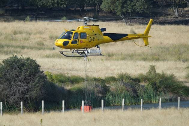 Helicopters help fight fires in San Martin de Valdeiglesias, west of Madrid, Spain, Tuesday, July 28, 2026 Cordon Press 
