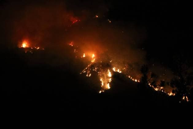 Crews battle forest fire in Antalya’s Kas district KAS, ANTALYA, TURKIYE - JULY 28: Flames and smoke rise from a forest fire as crews continue ground operations into the evening in the Kas district of Antalya, Turkiye, on July 28, 2026. Talip Demirci Anadolu Antalya Turkey. Editorial use only. Please get in touch for any other usage.  Copyright: x2026xAnadoluxTalipxDemircix