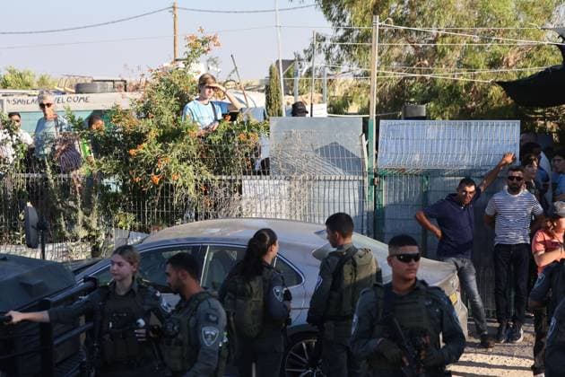 Israeli Forces Assault MK Ofer Cassif During Memorial Ceremony in Masafer Yatta UMM AL-KHAIR, West Bank July 28, 2026: Israeli soldiers and settlers gather near the site of a memorial ceremony marking the first anniversary of the death of Palestinian activist Odeh Al-Hathaleen in the village of Umm al-Khair, Masafer Yatta, south of Hebron, in the occupied West Bank, on July 28, 2026. During the incident, Israeli forces assaulted Israeli Knesset member Ofer Cassif. Umm Al-Khair Palestine, State of Copyright: x xMosabxshawerx xJNAxPressx