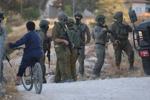 July 28, 2026, Umm Al-Khair, Palestine, State of: UMM AL-KHAIR, West Bank Ã¢â‚¬ July 28, 2026: Israeli soldiers and settlers gather near the site of a memorial ceremony marking the first anniversary of the death of Palestinian activist Odeh Al-Hathaleen in the village of Umm al-Khair, Masafer Yatta, south of Hebron, in the occupied West Bank, on July 28, 2026. During the incident, Israeli forces assaulted Israeli Knesset member Ofer Cassif. Umm Al-Khair Palestine, State of - ZUMAq101 20260728_zna_q101_109 Copyright: xMosabxShawerx