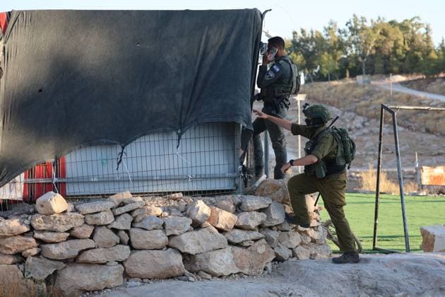 July 28, 2026, Umm Al-Khair, Palestine, State of: UMM AL-KHAIR, West Bank Ã¢â‚¬ July 28, 2026: Israeli soldiers and settlers gather near the site of a memorial ceremony marking the first anniversary of the death of Palestinian activist Odeh Al-Hathaleen in the village of Umm al-Khair, Masafer Yatta, south of Hebron, in the occupied West Bank, on July 28, 2026. During the incident, Israeli forces assaulted Israeli Knesset member Ofer Cassif. Umm Al-Khair Palestine, State of - ZUMAq101 20260728_zna_q101_108 Copyright: xMosabxShawerx
