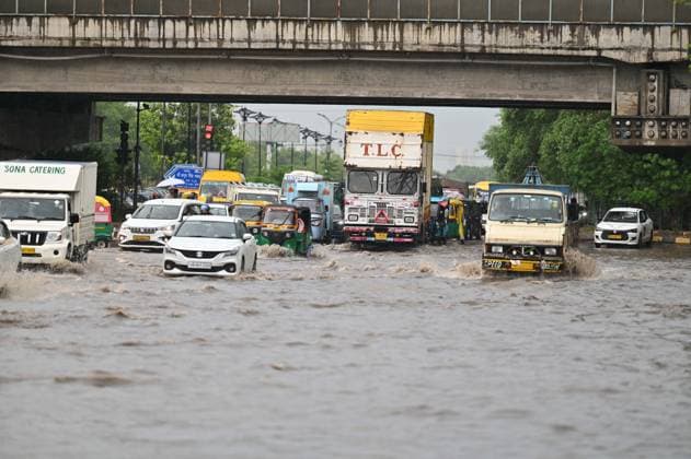 GURUGRAM, INDIA - JULY 28: Vehicles wade through a waterlogged stretch during rain on the sector-14 17 dividing road near MDI Chowk on July 28, 2026 in Gurugram, India. (Photo by Parveen Kumar Hindustan Times) Heavy Rains Inundates Gurugram