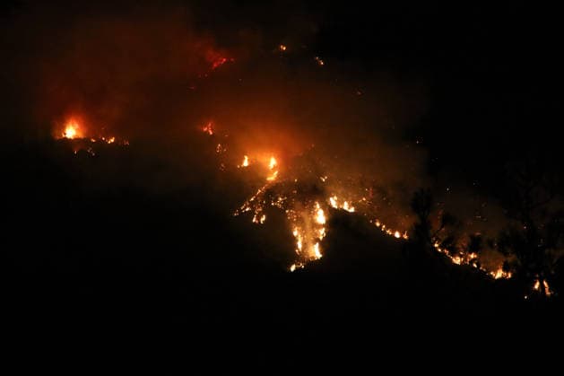 Crews battle forest fire in Antalya’s Kas district KAS, ANTALYA, TURKIYE - JULY 28: Flames and smoke rise from a forest fire as crews continue ground operations into the evening in the Kas district of Antalya, Turkiye, on July 28, 2026. Talip Demirci Anadolu Antalya Turkey. Editorial use only. Please get in touch for any other usage.  Copyright: x2026xAnadoluxTalipxDemircix