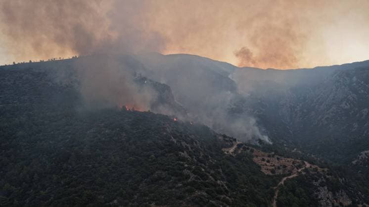 Crews battle forest fire in Antalya’s Kas district KAS, ANTALYA, TURKIYE - JULY 29: Flames and smoke rise from a forest fire as crews continue ground operations on the second day, in Kas district of Antalya, Turkiye, on July 29, 2026. Talip Demirci Anadolu Antalya Turkey. Editorial use only. Please get in touch for any other usage.  Copyright: x2026xAnadoluxTalipxDemircix