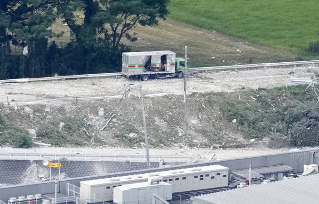 Aftermath of strong earthquake in Kumamoto Pref. Photo taken from a Kyodo News helicopter shows an abandoned truck near a destroyed Aeon Mall building in Kashima, Kumamoto Prefecture, on July 29, 2026, a day after an explosion apparently triggered by a gas leak following a powerful earthquake that hit the southwestern Japan prefecture.  A14AA0005624372P