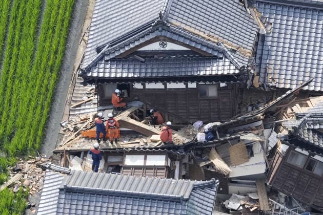 Aftermath of strong earthquake in Kumamoto Photo taken from a Kyodo News helicopter on July 29, 2026, shows search and rescue operations at a collapsed house in Hikawa, Kumamoto Prefecture, a day after a powerful earthquake hit the southwestern Japan prefecture.  A14AA0005624402P