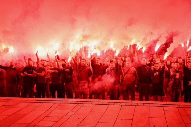 People hold burning flares in Maidan Nezalezhnosti Square during a commemorative ceremony marking the fourth anniversary of the Olenivka prison massacre, Kyiv, Ukraine, July 28, 2026. On the night of 28–29 July 2022, at least 53 Ukrainian prisoners of war were killed and more than 130 wounded in a Russian terrorist attack on the former Volnovakha Penal Colony No. 120 near the occupied settlement of Olenivka, Donetsk region, where defenders of Azovstal in Mariupol were being held. (Photo by Yevhen Kotenko Ukrinform) Kyiv remembers Olenivka prison massacre victims  Copyright: xYevhenxKotenkox