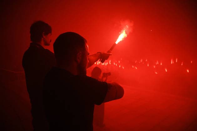 People hold burning flares in Maidan Nezalezhnosti Square during a commemorative ceremony marking the fourth anniversary of the Olenivka prison massacre, Kyiv, Ukraine, July 28, 2026. On the night of 28–29 July 2022, at least 53 Ukrainian prisoners of war were killed and more than 130 wounded in a Russian terrorist attack on the former Volnovakha Penal Colony No. 120 near the occupied settlement of Olenivka, Donetsk region, where defenders of Azovstal in Mariupol were being held. (Photo by Yevhen Kotenko Ukrinform) Kyiv remembers Olenivka prison massacre victims  Copyright: xYevhenxKotenkox