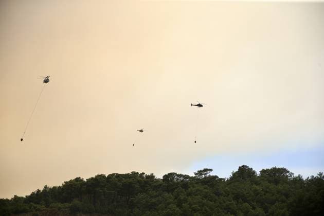 Firefighters battle wildfire in Mugla from air and ground MUGLA, TURKIYE - JULY 29 : Fire extinguishing efforts continue both from the air and land to contain a wildfire in the Seydikemer district of Mugla, Turkiye on July 29, 2026. Ali Riza Akkir Anadolu Mugla Turkey. Editorial use only. Please get in touch for any other usage.  Copyright: x2026xAnadoluxAlixRizaxAkkirx