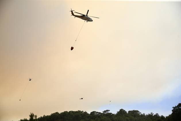 Firefighters battle wildfire in Mugla from air and ground MUGLA, TURKIYE - JULY 29 : Fire extinguishing efforts continue both from the air and land to contain a wildfire in the Seydikemer district of Mugla, Turkiye on July 29, 2026. Ali Riza Akkir Anadolu Mugla Turkey. Editorial use only. Please get in touch for any other usage.  Copyright: x2026xAnadoluxAlixRizaxAkkirx