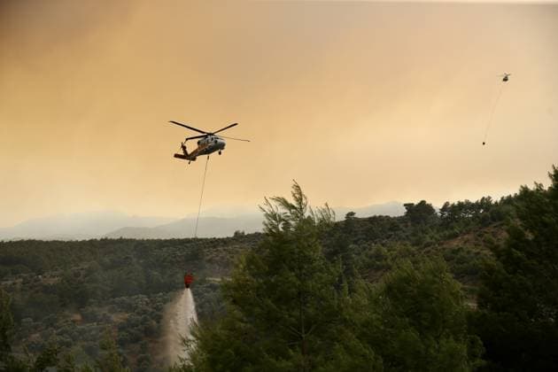 Firefighters battle wildfire in Mugla from air and ground MUGLA, TURKIYE - JULY 29 : Fire extinguishing efforts continue both from the air and land to contain a wildfire in the Seydikemer district of Mugla, Turkiye on July 29, 2026. Ali Riza Akkir Anadolu Mugla Turkey. Editorial use only. Please get in touch for any other usage.  Copyright: x2026xAnadoluxAlixRizaxAkkirx