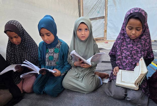 Orphaned Palestinian children attend Quran classes in Khan Younis camp Orphaned Palestinian boys and girls take part in Quran memorization and recitation classes at the Al Baraka Camp for Orphan Care in the al-Mawasi area of Khan Younis, southern Gaza Strip, on July 29, 2026. The educational sessions are held regularly to teach the Quran and strengthen the children s religious knowledge amid the difficult humanitarian conditions in the Gaza Strip. Photo by Tariq Mohammad APA Images Khan Yunis Gaza Strip Palestinian Territory 290726_Khan_Yunis_TM_00(13) Copyright: xapaimagesxTariqxMohammad xapaimagesx