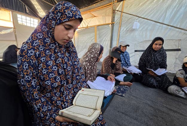 Orphaned Palestinian children attend Quran classes in Khan Younis camp Orphaned Palestinian boys and girls take part in Quran memorization and recitation classes at the Al Baraka Camp for Orphan Care in the al-Mawasi area of Khan Younis, southern Gaza Strip, on July 29, 2026. The educational sessions are held regularly to teach the Quran and strengthen the children s religious knowledge amid the difficult humanitarian conditions in the Gaza Strip. Photo by Tariq Mohammad APA Images Khan Yunis Gaza Strip Palestinian Territory 290726_Khan_Yunis_TM_00(7) Copyright: xapaimagesxTariqxMohammad xapaimagesx
