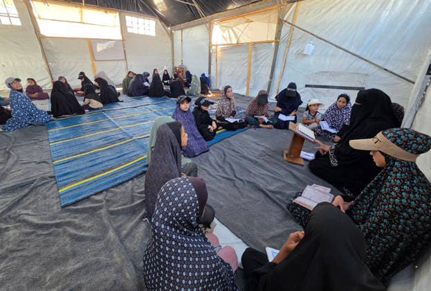 Orphaned Palestinian children attend Quran classes in Khan Younis camp Orphaned Palestinian boys and girls take part in Quran memorization and recitation classes at the Al Baraka Camp for Orphan Care in the al-Mawasi area of Khan Younis, southern Gaza Strip, on July 29, 2026. The educational sessions are held regularly to teach the Quran and strengthen the children s religious knowledge amid the difficult humanitarian conditions in the Gaza Strip. Photo by Tariq Mohammad APA Images Khan Yunis Gaza Strip Palestinian Territory 290726_Khan_Yunis_TM_00(1) Copyright: xapaimagesxTariqxMohammad xapaimagesx