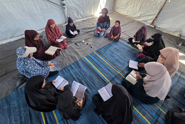 Orphaned Palestinian children attend Quran classes in Khan Younis camp Orphaned Palestinian boys and girls take part in Quran memorization and recitation classes at the Al Baraka Camp for Orphan Care in the al-Mawasi area of Khan Younis, southern Gaza Strip, on July 29, 2026. The educational sessions are held regularly to teach the Quran and strengthen the children s religious knowledge amid the difficult humanitarian conditions in the Gaza Strip. Photo by Tariq Mohammad APA Images Khan Yunis Gaza Strip Palestinian Territory 290726_Khan_Yunis_TM_00(4) Copyright: xapaimagesxTariqxMohammad xapaimagesx