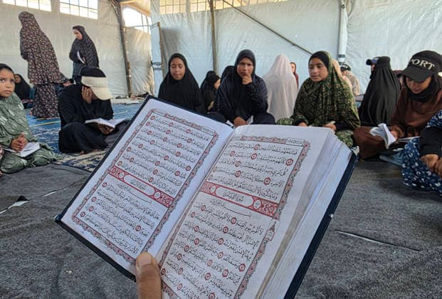 Orphaned Palestinian children attend Quran classes in Khan Younis camp Orphaned Palestinian boys and girls take part in Quran memorization and recitation classes at the Al Baraka Camp for Orphan Care in the al-Mawasi area of Khan Younis, southern Gaza Strip, on July 29, 2026. The educational sessions are held regularly to teach the Quran and strengthen the children s religious knowledge amid the difficult humanitarian conditions in the Gaza Strip. Photo by Tariq Mohammad APA Images Khan Yunis Gaza Strip Palestinian Territory 290726_Khan_Yunis_TM_00(5) Copyright: xapaimagesxTariqxMohammad xapaimagesx