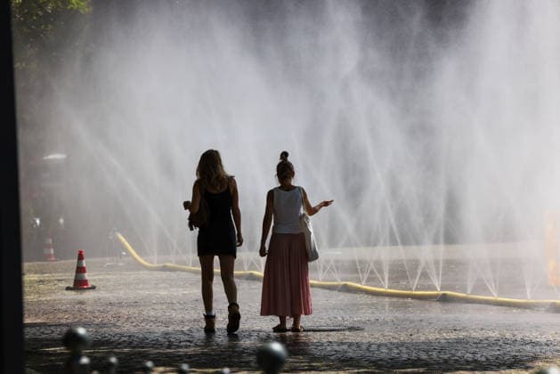 Cologne unveils cooling mist initiative as heatwave grips Germany COLOGNE, GERMANY - JULY 29: People try to cool off at Rudolfplatz Square during the Cooling Cologne initiative, where chilled groundwater was dispersed through fine mist sprays connected to fire hoses in Cologne, Germany on July 29, 2026. Organizers said the system lowered the surrounding temperature by about 12 degrees Celsius, offering relief as a heatwave swept across the region. Kadir Ilboga Anadolu Cologne Germany. Editorial use only. Please get in touch for any other usage.  Copyright: x2026xAnadoluxKadirxIlbogax