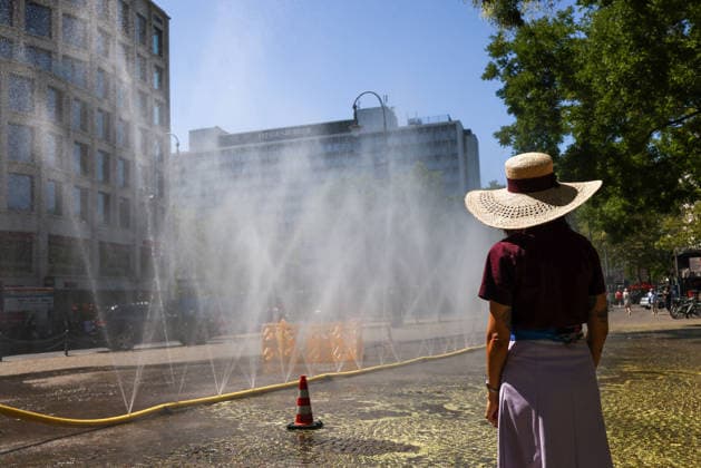 Cologne unveils cooling mist initiative as heatwave grips Germany COLOGNE, GERMANY - JULY 29: People try to cool off at Rudolfplatz Square during the Cooling Cologne initiative, where chilled groundwater was dispersed through fine mist sprays connected to fire hoses in Cologne, Germany on July 29, 2026. Organizers said the system lowered the surrounding temperature by about 12 degrees Celsius, offering relief as a heatwave swept across the region. Kadir Ilboga Anadolu Cologne Germany. Editorial use only. Please get in touch for any other usage.  Copyright: x2026xAnadoluxKadirxIlbogax