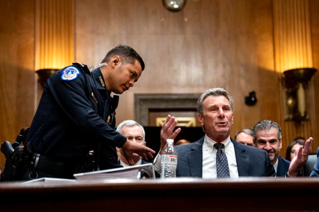 David Schertler, an attorney for Former Director of the National Institute of Allergy and Infectious Diseases Dr. Anthony Fauci, is escorted from the Senate Homeland Security and Governmental Affairs Committee hearing at the U.S. Capitol in Washington, DC on Wednesday, July 29, 2026. Fauci was expected to be questioned about his diary entries during his handling of the Covid-19 pandemic, but invoked his fifth amendment rights.  WAP20260729319 BONNIExCASH