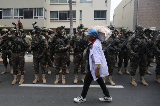 Keiko Fujimori presided over the grand civic military parade in her first official ceremony as president LIMA, PERU - JULY 29: A pedestrian walks past members of the Peruvian Army as they prepare for the civic-military parade marking the 205th anniversary of Peru s Independence in Lima, Peru, on July 29, 2026. The ceremony takes place one day after President Keiko Fujimori takes office and is among the country s most important official national celebrations. Klebher Vasquez Anadolu Lima Peru. Editorial use only. Please get in touch for any other usage.  Copyright: x2026xAnadoluxKlebherxVasquezx