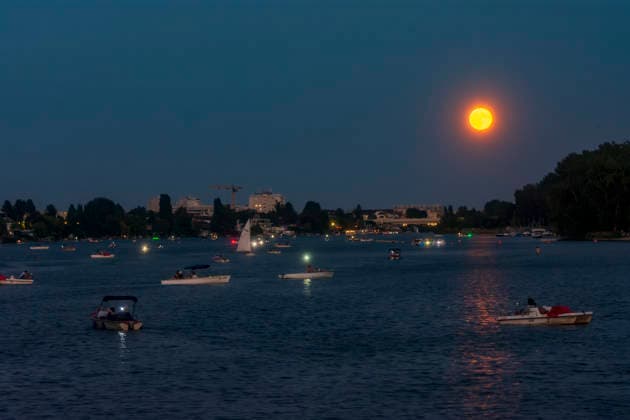 oxbow lake Alte Donau (Old Danube), full moon rise, boats Vienna 22. Donaustadt Wien Austria