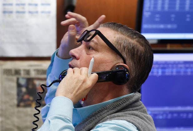 Traders work on the floor of the New York Stock Exchange on Wall Street on Wednesday, July 29, 2026 in New York City. Stocks tumbled for multiple reasons on Wednesday as the central bank chose to keep interest rates unchanged. The Dow Jones Industrial Average closed 1,153 points lower, or 2.2%, for its worst decline since April 2025.  NYP20260729113 JOHNxANGELILLO
