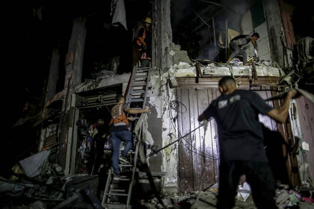 Israeli army continues attacks on civilian homes in Gaza GAZA CITY, GAZA STRIP, PALESTINE - JULY 30: Firefighters respond to a fire in a damaged building near Al-Ahli (Baptist) Hospital after an Israeli strike in eastern Gaza City, Gaza Strip, Palestine on July 30, 2026. According to local sources, the strike targeted the building near the hospital following a renewed ceasefire violation, causing damage and igniting a fire. Saeed M. M. T. Jaras Anadolu Gaza City Gaza. Editorial use only. Please get in touch for any other usage.  Copyright: x2026xAnadoluxSaeedxM.xM.xT.xJarasx
