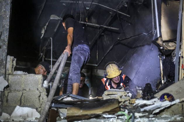 Israeli army continues attacks on civilian homes in Gaza GAZA CITY, GAZA STRIP, PALESTINE - JULY 30: Firefighters respond to a fire in a damaged building near Al-Ahli (Baptist) Hospital after an Israeli strike in eastern Gaza City, Gaza Strip, Palestine on July 30, 2026. According to local sources, the strike targeted the building near the hospital following a renewed ceasefire violation, causing damage and igniting a fire. Saeed M. M. T. Jaras Anadolu Gaza City Gaza. Editorial use only. Please get in touch for any other usage.  Copyright: x2026xAnadoluxSaeedxM.xM.xT.xJarasx