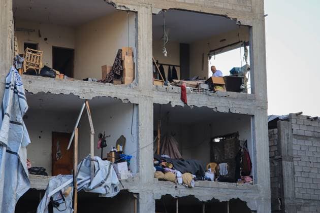 Palestinians inspect damaged homes after Israeli airstrike in Gaza City GAZA CITY, PALESTINE JULY 30, 2026: Palestinians inspect damaged homes following an Israeli airstrike that struck the Shamia family house overnight in Gaza City, causing extensive destruction to the targeted building and damage to neighboring homes amid the ongoing war in the Gaza Strip. Gaza Palestine, State of Copyright: x xMohammedxMxSkaikx xJNAxPressx