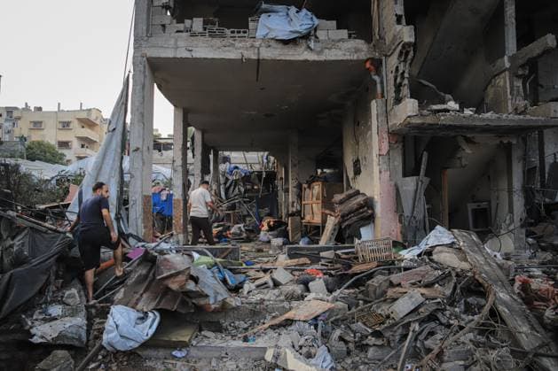 Palestinians inspect damaged homes after Israeli airstrike in Gaza City GAZA CITY, PALESTINE JULY 30, 2026: Palestinians inspect damaged homes following an Israeli airstrike that struck the Shamia family house overnight in Gaza City, causing extensive destruction to the targeted building and damage to neighboring homes amid the ongoing war in the Gaza Strip. Gaza Palestine, State of Copyright: x xMohammedxMxSkaikx xJNAxPressx