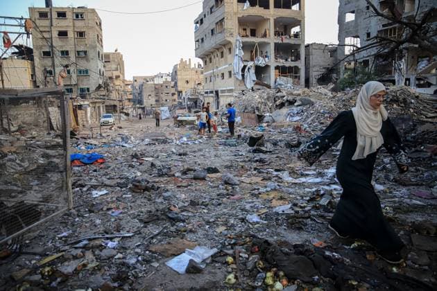 Palestinians inspect damaged homes after Israeli airstrike in Gaza City GAZA CITY, PALESTINE JULY 30, 2026: Palestinians inspect damaged homes following an Israeli airstrike that struck the Shamia family house overnight in Gaza City, causing extensive destruction to the targeted building and damage to neighboring homes amid the ongoing war in the Gaza Strip. Gaza Palestine, State of Copyright: x xMohammedxMxSkaikx xJNAxPressx
