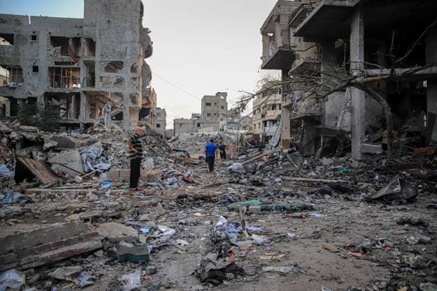 Palestinians inspect damaged homes after Israeli airstrike in Gaza City GAZA CITY, PALESTINE JULY 30, 2026: Palestinians inspect damaged homes following an Israeli airstrike that struck the Shamia family house overnight in Gaza City, causing extensive destruction to the targeted building and damage to neighboring homes amid the ongoing war in the Gaza Strip. Gaza Palestine, State of Copyright: x xMohammedxMxSkaikx xJNAxPressx