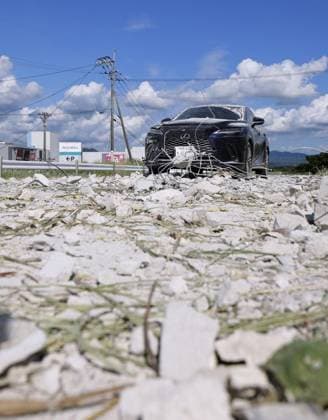 Aftermath of Aeon mall explosion following Kumamoto quake Photo taken July 29, 2026, shows a car left near an Aeon shopping mall in Kashima in Kumamoto Prefecture where a deadly explosion occurred the previous day following a powerful earthquake that hit the southwestern Japan prefecture and its vicinity.  A14AA0005624523P
