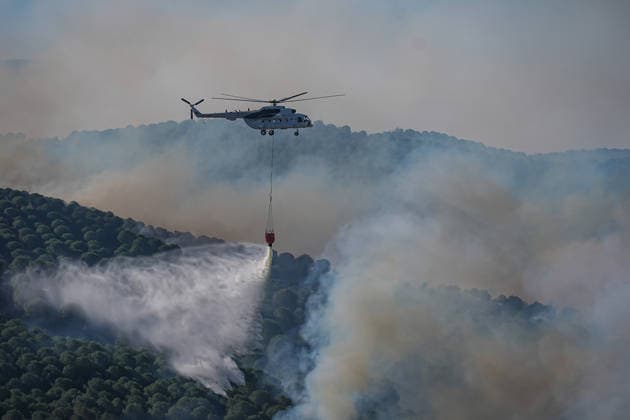Firefighters battle forest fire for second day in Balikesir s Gomec district BALIKESIR, TURKIYE - JULY 30: Aerial and ground firefighting operations continue for a second day to contain a forest fire in the Gomec district of Balikesir, Turkiye, on July 30, 2026. Sergen Sezgin Anadolu Balikesir Turkey. Editorial use only. Please get in touch for any other usage.  Copyright: x2026xAnadoluxSergenxSezginx