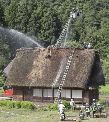 Thatched-roof house catches fire in World Heritage-listed village Firefighters water a traditional thatched-roof house in the World Heritage-listed Gokayama hamlet in Nanto in Toyama Prefecture, central Japan, on July 30, 2026. No one was injured in the fire, put under control about 50 minutes after the incident was reported to the local fire station.  A14AA0005624598P