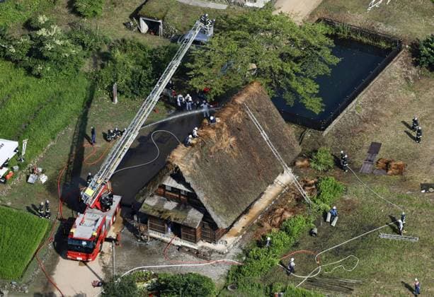 Thatched-roof house catches fire in World Heritage-listed village Photo taken from a Kyodo News helicopter shows firefighters watering a traditional thatched-roof house in the World Heritage-listed Gokayama hamlet in Nanto in Toyama Prefecture, central Japan, on July 30, 2026. No one was injured in the fire, put under control about 50 minutes after the incident was reported to the local fire station.  A14AA0005624601P