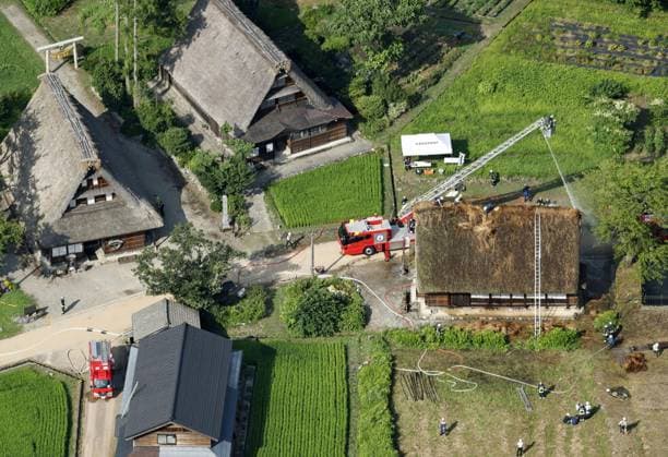 Thatched-roof house catches fire in World Heritage-listed village Photo taken from a Kyodo News helicopter shows firefighters watering a traditional thatched-roof house in the World Heritage-listed Gokayama hamlet in Nanto in Toyama Prefecture, central Japan, on July 30, 2026. No one was injured in the fire, put under control about 50 minutes after the incident was reported to the local fire station.  A14AA0005624602P