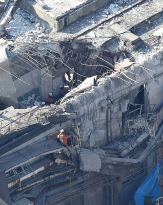 Aftermath of strong earthquake in Kumamoto Photo taken from a Kyodo News helicopter shows search and rescue operations continuing for a missing person at a partially destroyed Nippon Paper Industries Co. plant in Yatsushiro, Kumamoto Prefecture, on July 30, 2026, two days after a powerful earthquake hit the southwestern Japan prefecture.  A14AA0005624610P