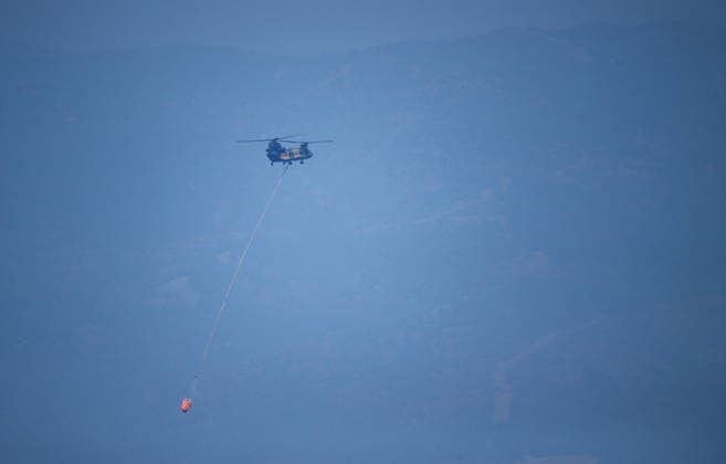 Firefighters battle wildfire in Mugla from air and ground MUGLA, TURKIYE - JULY 30 : Fire extinguishing efforts continue both from the air and land to contain a wildfire in the Seydikemer district of Mugla, Turkiye on July 30, 2026. Mahmut Serdar Alakus Anadolu Mugla Turkey. Editorial use only. Please get in touch for any other usage.  Copyright: x2026xAnadoluxMahmutxSerdarxAlakusx